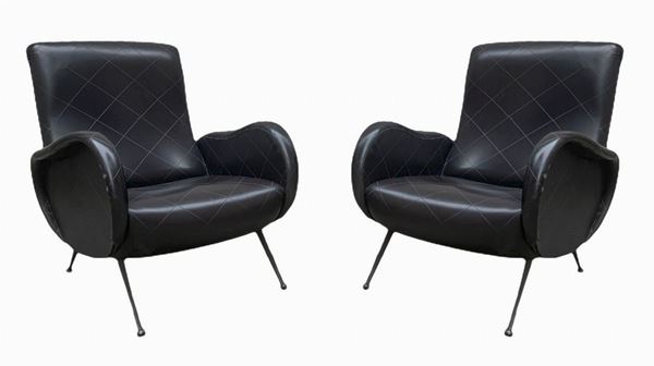 Italian production in the style of Marco Zanuso. Pair of armchairs. 1960s, wooden structure coating in tissured sky, brass feet. ...