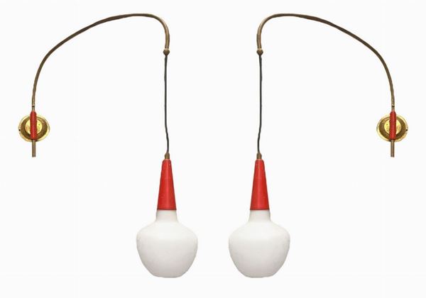 Italian production in the Arredoluce Monza style. Pair of appliques. Zapponate brass structure and lacquered aluminum in red tones, ...