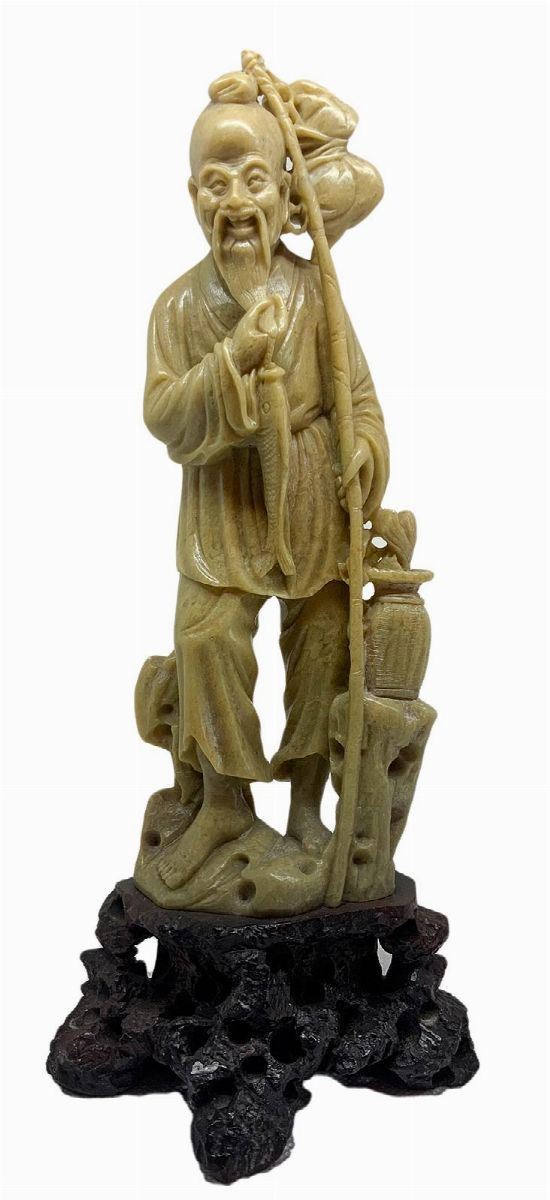 Soapwort stone statuette depicting God Ebisu "God of the richness of the sea and fishing" one of the seven sages. Provenance Beijing Early years of the '900. H 26 cm 11 cm Base