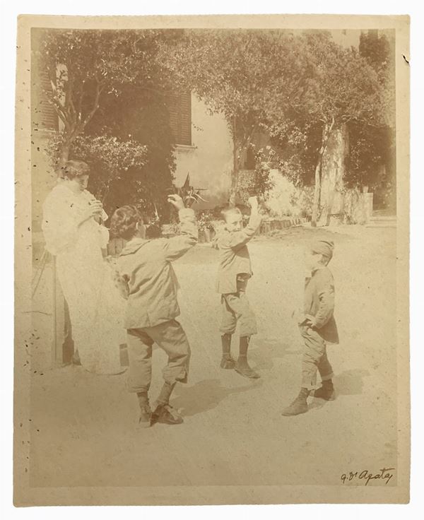 Gaetano D'Agata (1883-1949), photos depicting children dancing with flute player. Signed on the front and hallmarked on the back. Numbered 244 Cm 22,5x18

"Gaetano D'Agata is part of the group of photographers who end up on the 800 dedicated themselves to photography in southern Italy, working closely with the likes of Von Gloeden caliber.
A native of Aci Sant'Antonio, moved soon to Taormina where he married a local woman and worked with Von Gloeden as witnessed by many photos of the latter se
