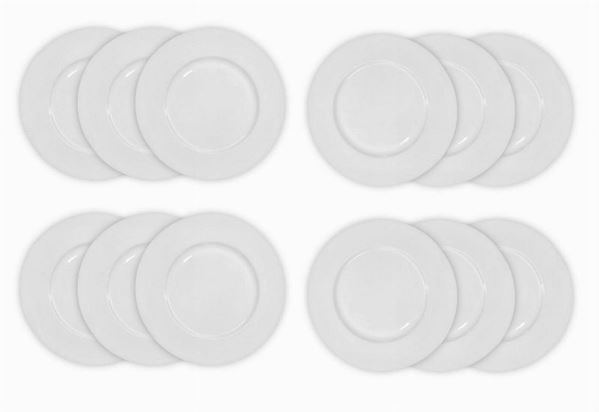 Group of 12 white porcelain underpols. Le Coquet, Limoges-France. Muscade forms. Diameter 30.5 cm.