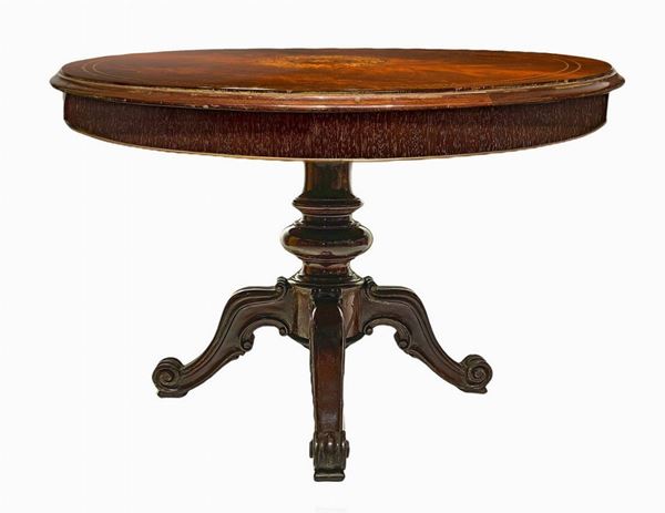 Round table with four-spoke central foot in solid mahogany, nineteenth century. 19th century, mahogany feather veneered floor with inlays ...