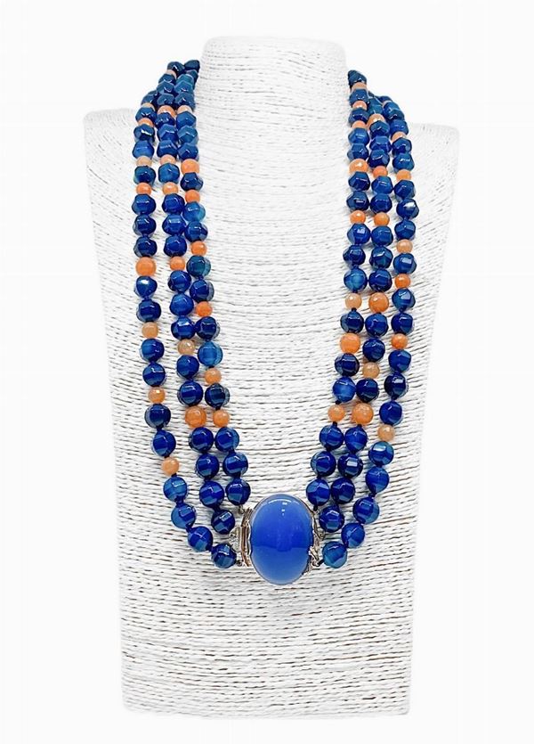 Faceted blue agate necklace 12 mm, alternating with faceted Eosite 6/8 mm. (orange adventurine). Gold lacquered silver closure with central ...