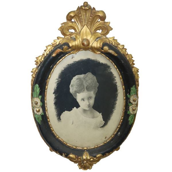 Oval frame with gold decorations and print