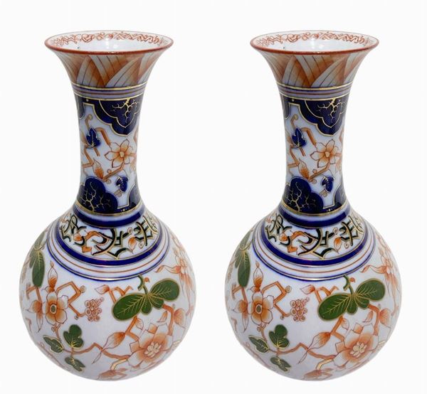Pair of chinese porcelain vases with orange flower decoration on a white background, China. H 33 cm