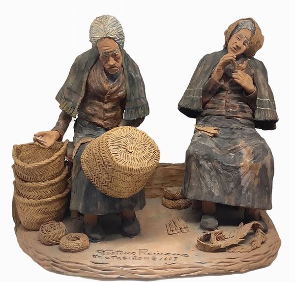 Polychrome terracotta sculptural group depicting two old women working on wicker baskets