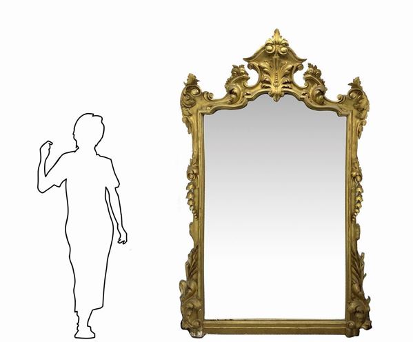 Important mirror in gilded wood