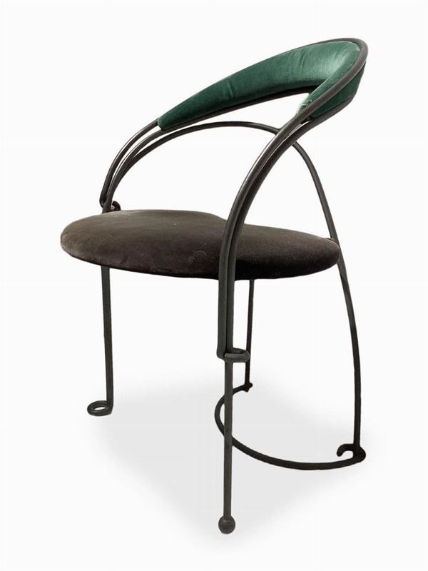 Iron armchair with velvet seat.