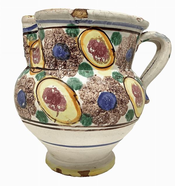 Cannata majolica of Caltagirone, the early twentieth century. With polychrome decoration of flowers and fruits. H 21 cm