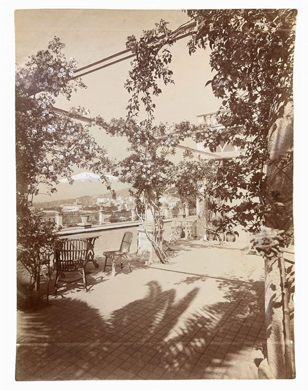 Gaetano D'Agata (1883-1949), albumin photos depicting Etna view from the terrace of the Hotel Timeo in Taormina. hallmarked on the back. Numbered 166 Cm 22x17

"Gaetano D'Agata is part of the group of photographers who end up on the 800 dedicated themselves to photography in southern Italy, working closely with the likes of Von Gloeden caliber.
A native of Aci Sant'Antonio, moved soon to Taormina where he married a local woman and worked with Von Gloeden as witnessed by many photos of the latt
