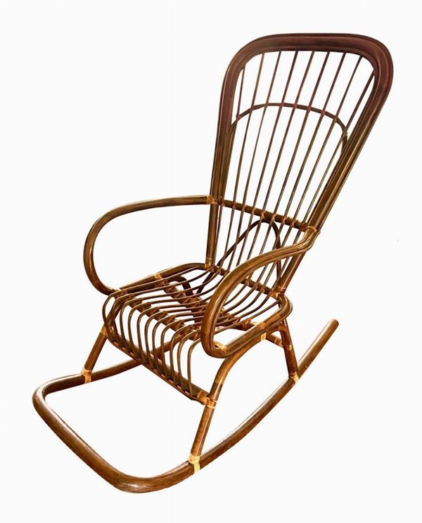 Rocking rattan armchair.
H 115 cm, 55 cm width, 110 cm depth
