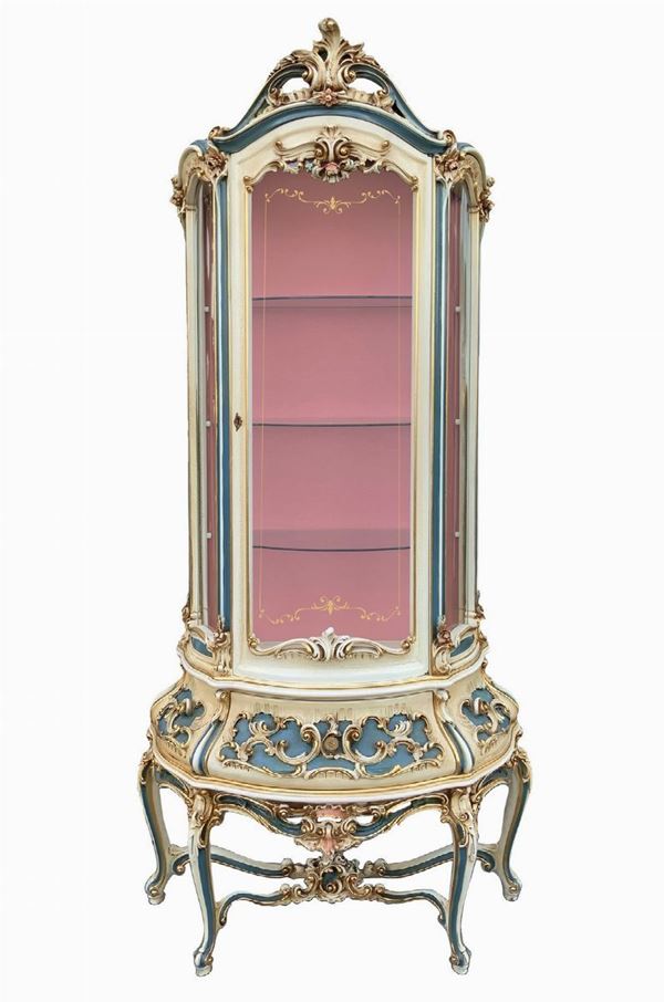 Cristalliera in Venetian Rococo Style. Two lacquered bodies in beige, blue and golden brackets. Body higher than rounded glasses, interior with three ...
