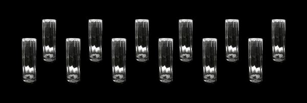 Servizio di bicchieri da 12 persone in cristallo forma cilindrica poliedrica con base in argento. Punzone anni ’60. Firenze. H cm 18. 