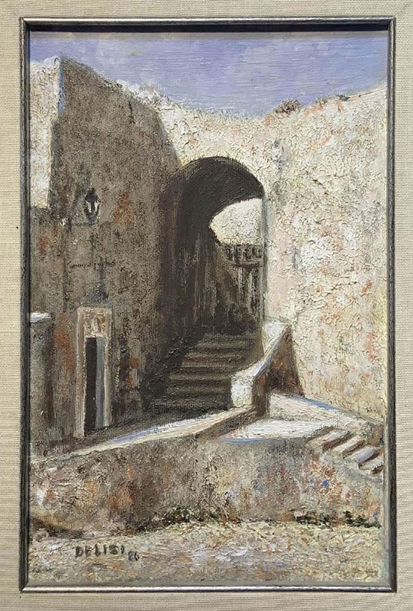 Dipinto ad olio su tela raffigurante scorcio di paese, De Lisi. Cm 29x18,5, olio su tela. Firmato e datato 1986 in basso a sinistra.
