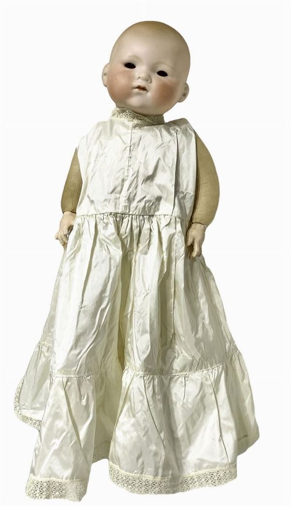 Doll newborn bisque, fabric , missing eyes and hair, white baptism dress with embroidery at the neck and hem, curved limbs, signed A. M. Germany, full head, h 52 cm