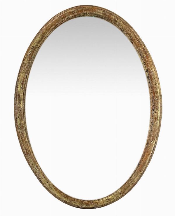 Oval mirror with golden frame