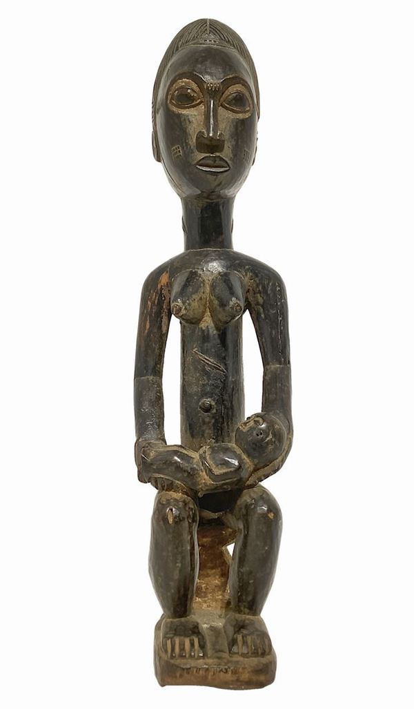 Baule's Statue of maternity, Ivory Coast. Mid-twentieth century. H 48 cm