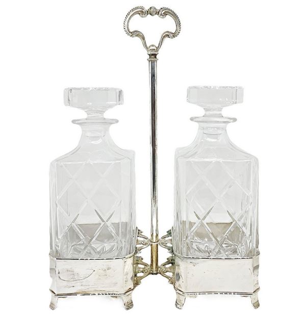 Pair of bottles with silver support. Gr.370
H cm 34. L. 22 cm. Base 22x10 cm.