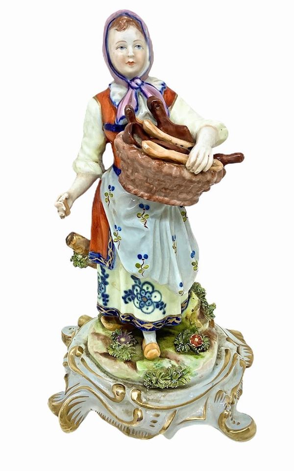 Capodimonte figurine depicting tablespoons vendor woman late nineteenth century. H 21 cm It has small lack