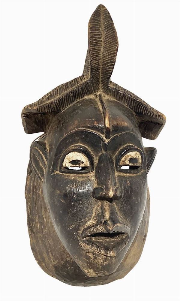 Baule mask, Ivory Coast, the second half of the twentieth century. H cm 40. Break