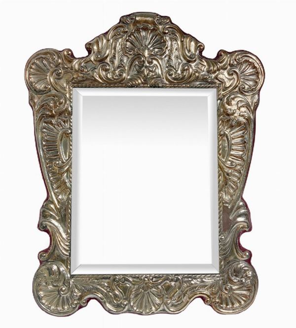 Frame with mirror
. 20th century, in 925 punched silver in Baroque style
H cm 50x40