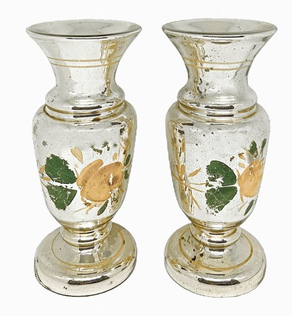 Pair of Murano glass vases silver mercury decorated with polychrome floral motifs, the nineteenth century. H 19 cm



