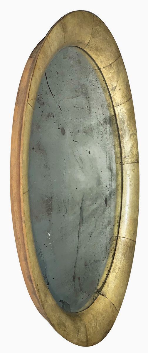Aldo Tura. Anni '50. Specchiera con struttura in legno rivestita in pergamena, segni di uso. 
. 
Cm 51x30