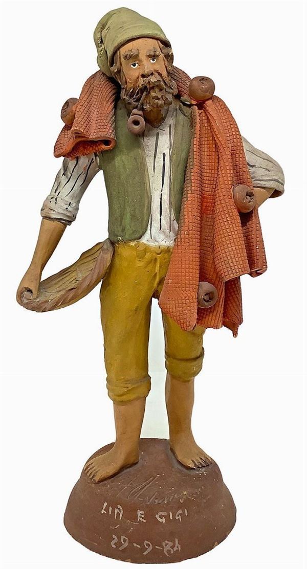 Scultura in terracotta policroma raffigurante pescatore, Caltagirone. Datato sulla base 1984. H cm 24.