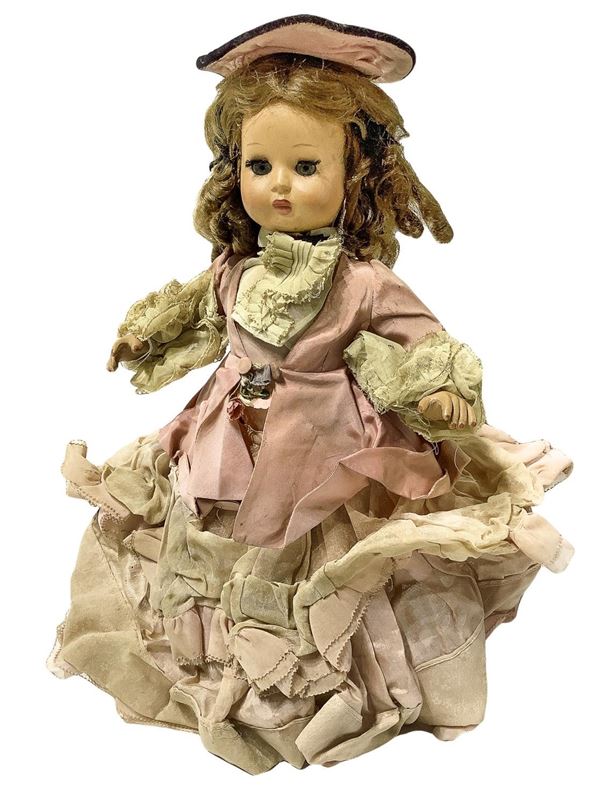 Bambola "Furga", abito rosa ottocentesco con cappellino, capelli mohair, occhi mobili, arti rigidi, firma " Furga", 1945-50, provenienza Italia, h cm 40 ca.