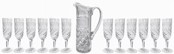 12 goblets set and 1 carafe crystal. H Cm 18, base 6 Cm, Cm Mouth 5. Carafe H 28 Cm, Cm Base 9