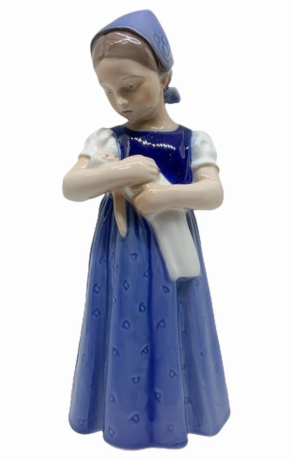 Copenhagen porcelain figurine depicting a child with doll. H 20 cm