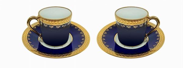 set of cups tet-a-tet porcelain, Limoges, France, twentieth century. Color blue and gold decorations. Cup h 4.5 cm