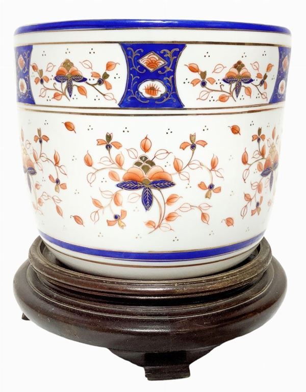 Chinese Cachepot with Floral decorations in orange and blue, wooden base