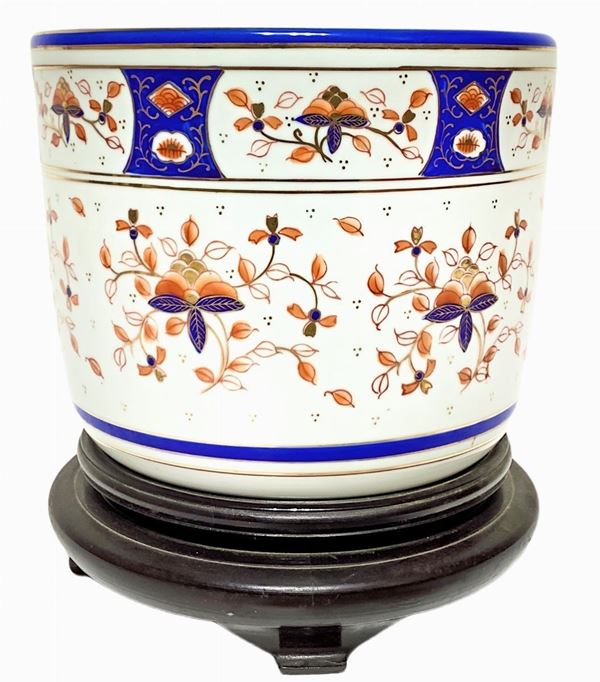 Chinese Cachepot with Floral decorations in orange and blue, wooden base