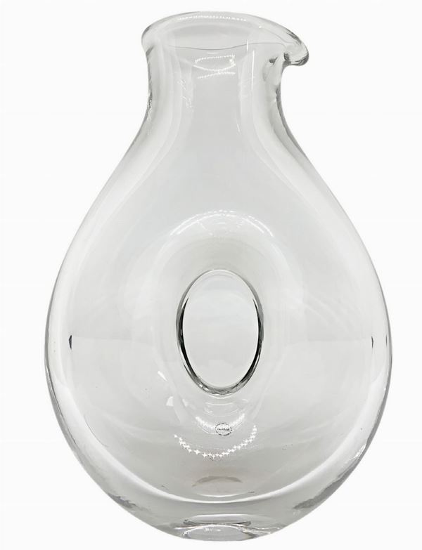 Glass jug with closed center.
H 25 cm